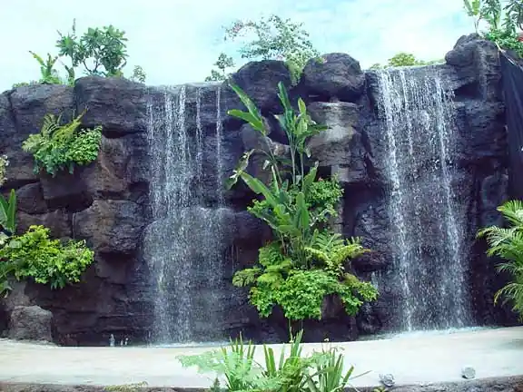 Rock waterfall set into tropical planting
