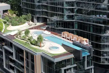 Anaha tower podium with a rooftop pool and spa, planted terraces and loungers