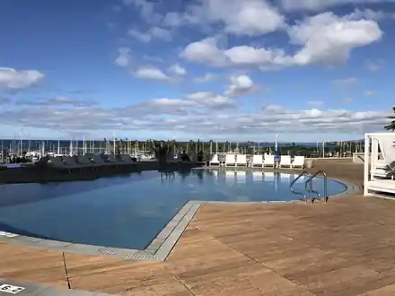 Renovated Hawaii Prince pool deck with a curved edge above the Ala Wai marina